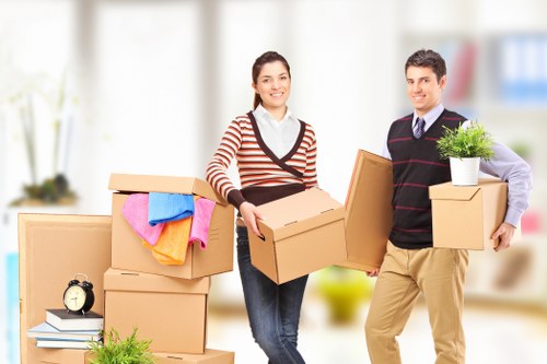 Professional movers handling compact household items in Abbeywood