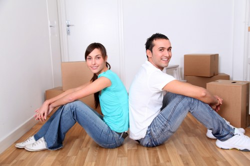 Professional movers loading items for an apartment relocation