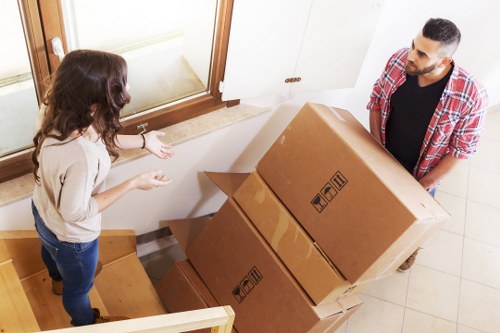 Staff preparing desks and labeled boxes for an Abbeywood office move