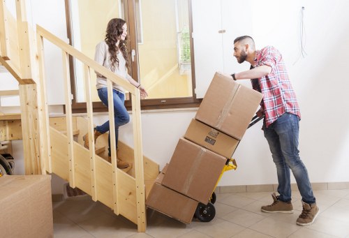 Packed boxes and furniture ready for a flat removal service